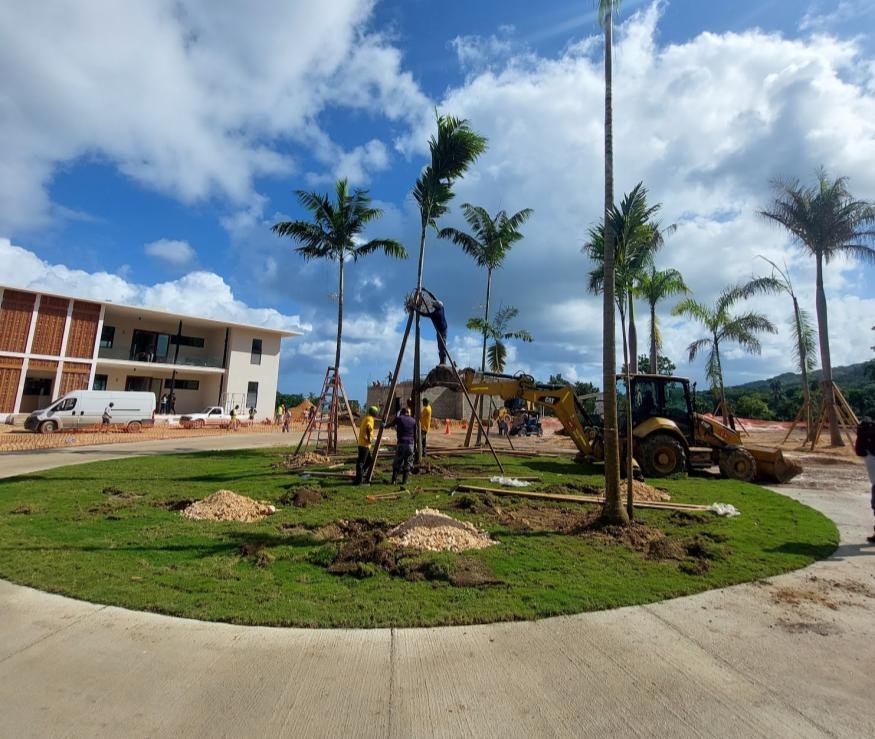 A planted circle in front of the villas