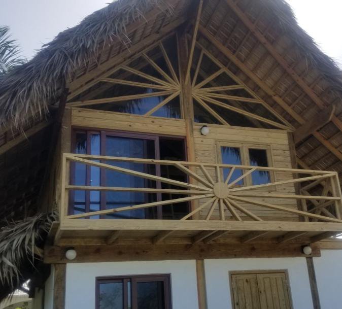 A thatched roof and timber gable detail
